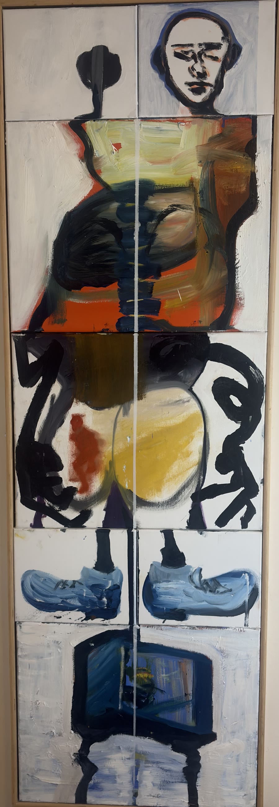 Tall painting of a standing figure assembled from ten stacked canvas panels: a pale head, an orange torso, hips with a yellow form, blue sneakers, and a dark boxed form on splayed legs at the base.